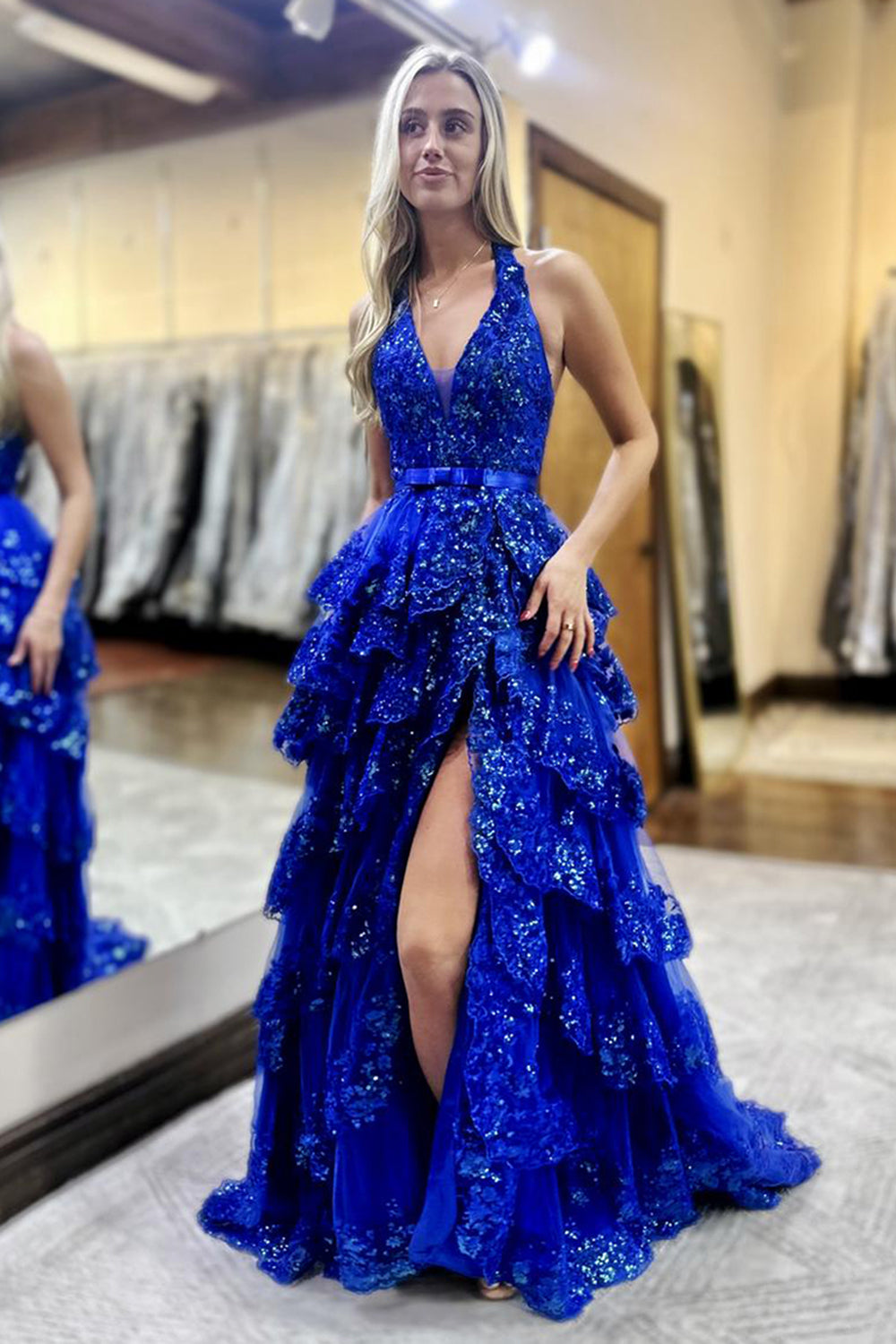Royal Blue Glitter Halter Prom Dress Featuring a Bow and Long Ruffles