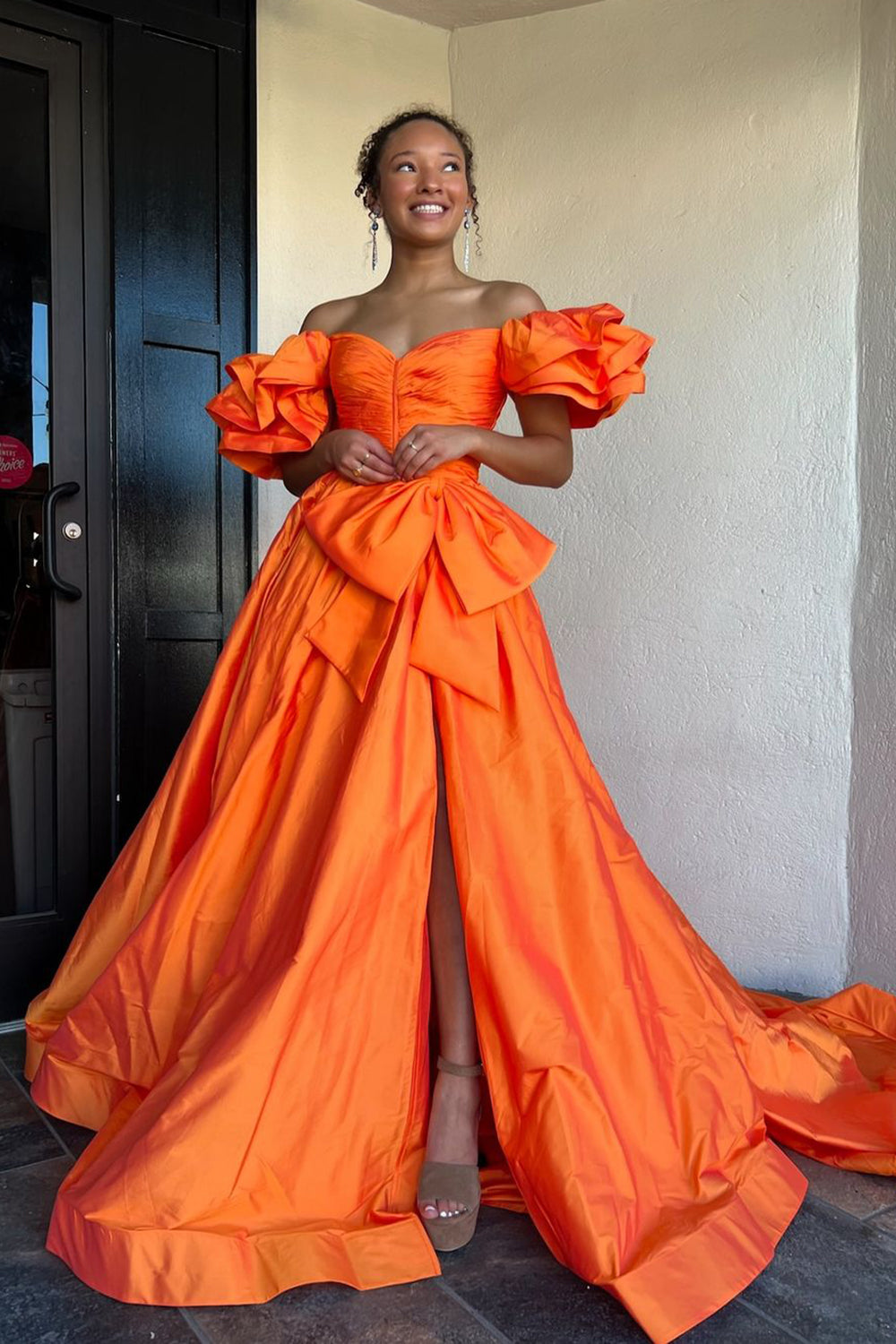 Elegant Orange A-Line Prom Gown with Puff Sleeves Ruched Detail and Bow