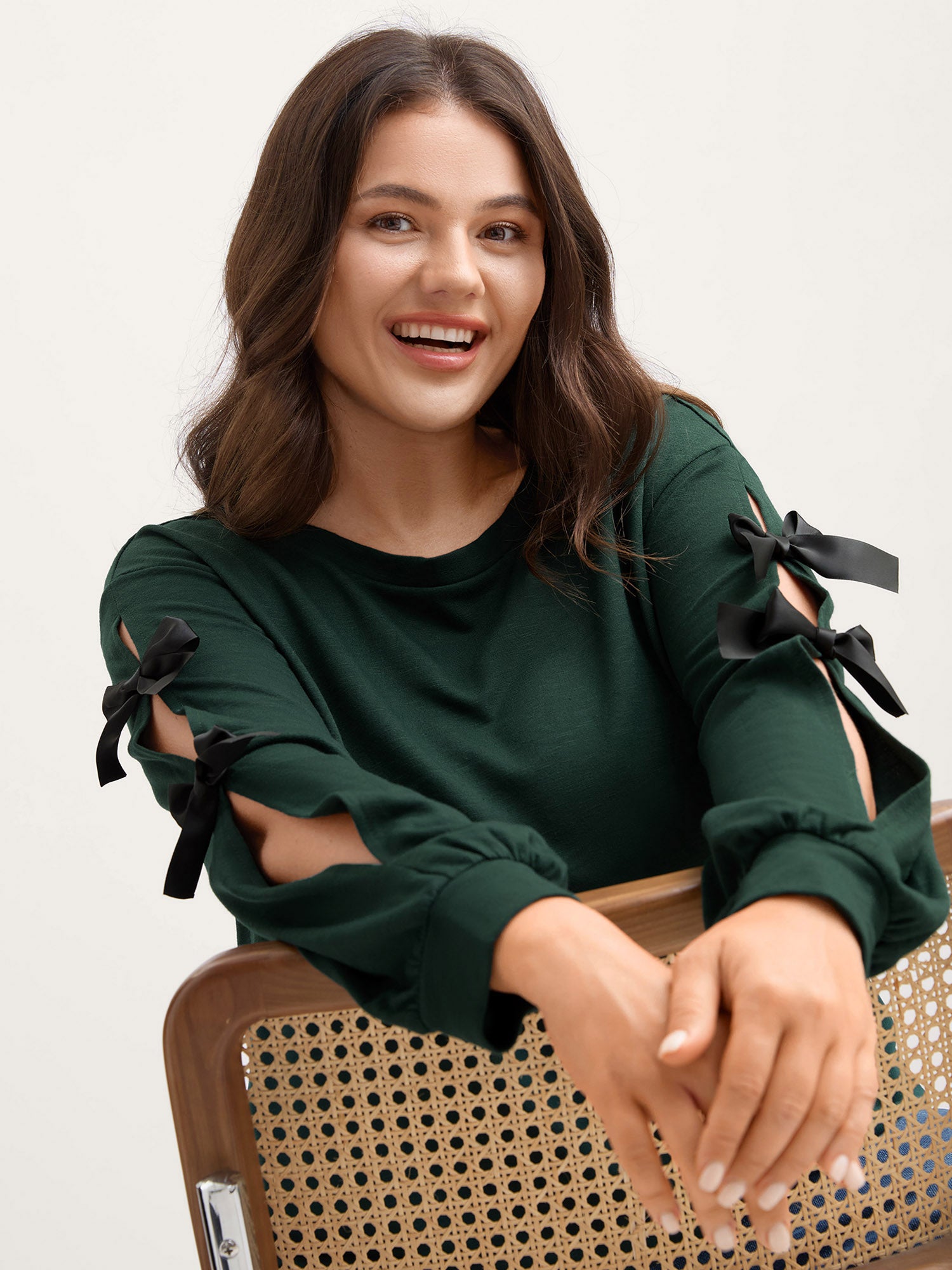 Bow-Knot Sleeve Cut-Out Sweatshirt