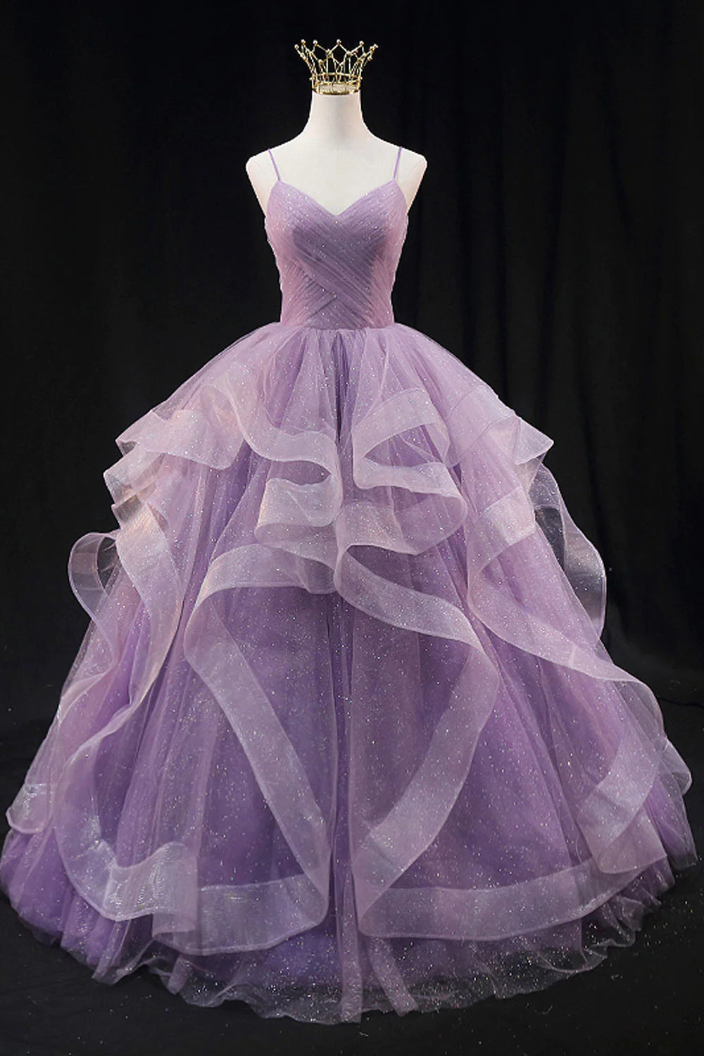 Light purple long prom dress with spaghetti straps and ruffles in an A-line cut